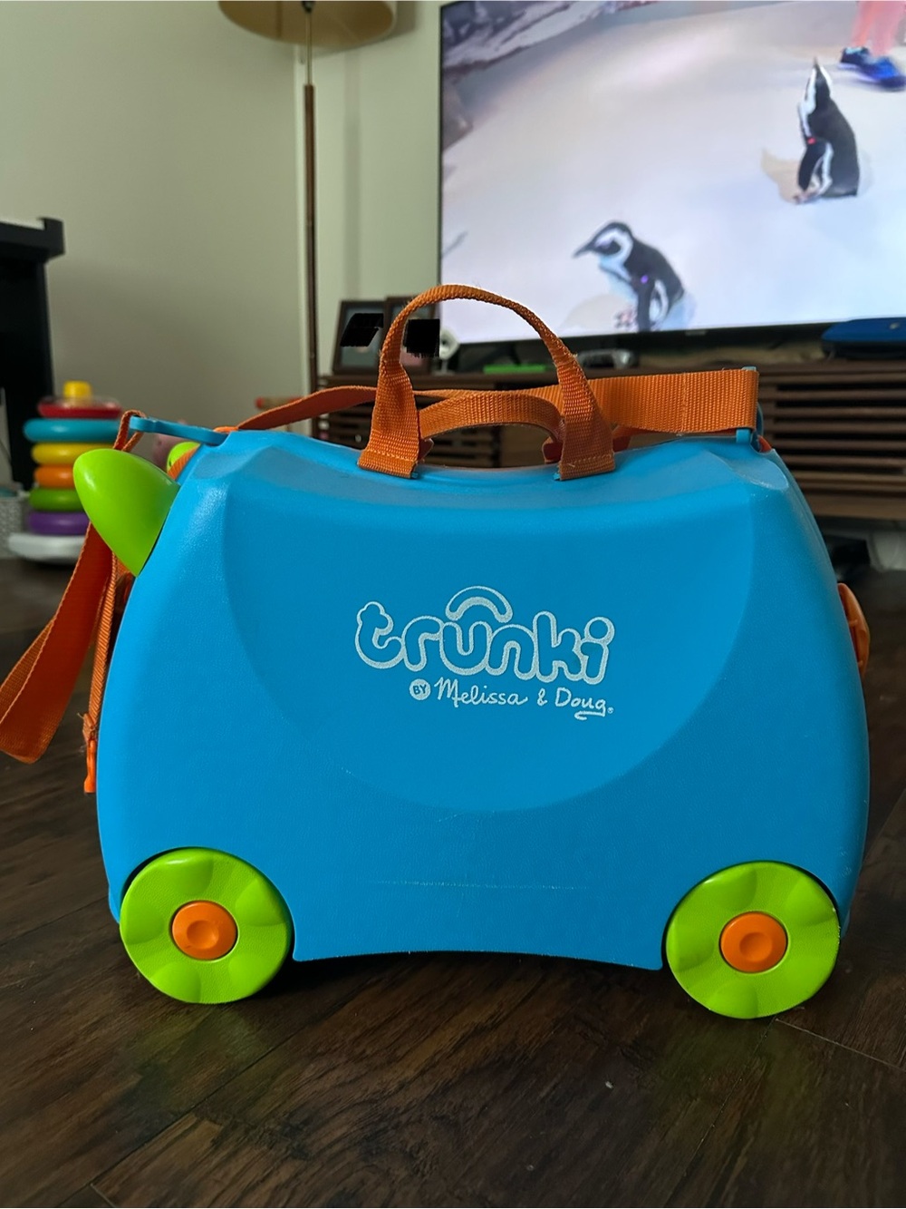 Melissa & Doug Trunki Ride-On Suitcase - Blue with Green & Orange Accents